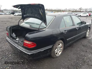 2002 Mercedes-Benz E-Class with VIN WDBJF82J52X064244, listed as a IAAI auction lot 41819863 with 999,999 mi miles. Bid and sale history available at carsss.com. Image 4.