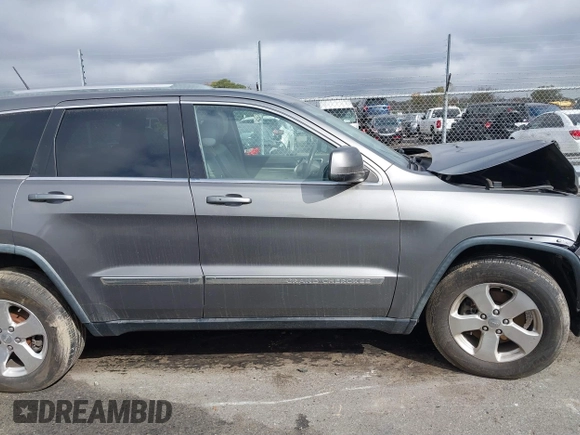 2012 Jeep Grand Cherokee Laredo with VIN 1C4RJFAG8CC298268, listed as a IAAI auction lot 40787833 with 206,486 mi miles. Bid and sale history available at carsss.com. Image 12.