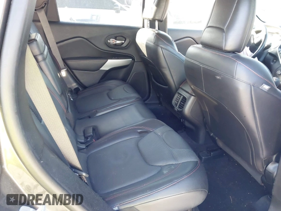 2018 Jeep Cherokee Trailhawk with VIN 1C4PJMBX7JD517299, listed as a IAAI auction lot 42022770 with 62,865 mi miles. Bid and sale history available at carsss.com. Image 8.