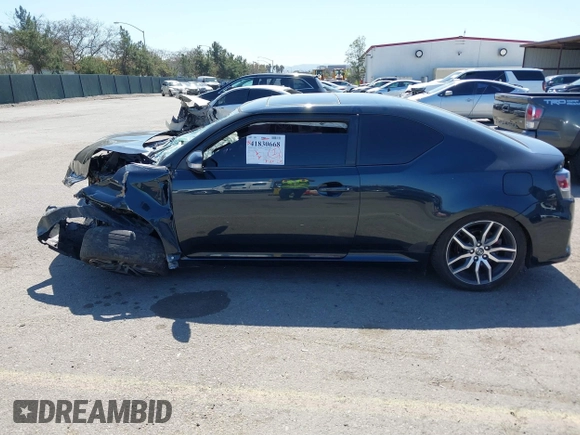 2015 Scion tC with VIN JTKJF5C77F3094936, listed as a IAAI auction lot 41830668 with 89,727 mi miles. Bid and sale history available at carsss.com. Image 15.