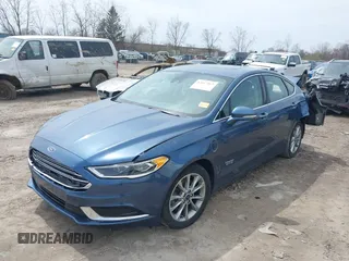 2018 Ford Fusion Energi SE with VIN 3FA6P0PU0JR196091, listed as a IAAI auction lot 42017867 with 70,284 mi miles. Bid and sale history available at carsss.com. Image 2.