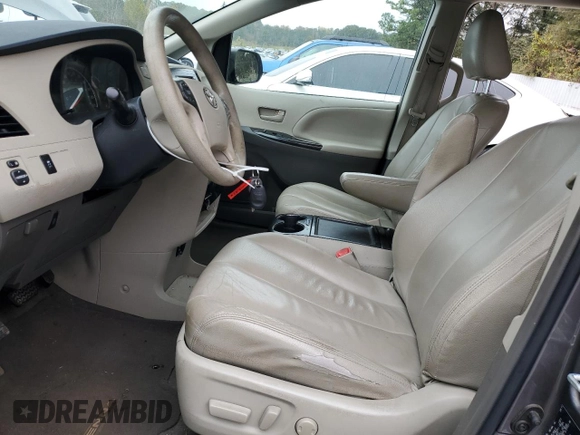 2012 Toyota Sienna with VIN 5TDKA3DC8CS009526, listed as a Copart auction lot 80279714 with 186,703 mi miles and Salvage Title. Bid and sale history available at DreamBid. Image 7.