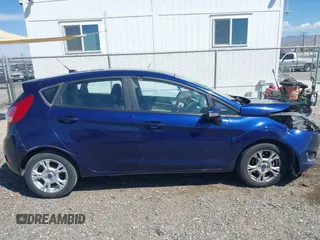 2016 Ford Fiesta SE z VIN 3FADP4EJ8GM150098, wystawiony jako IAAI lot #41890402 z przebiegiem 126 492 mil mil oraz . Historia ofert i sprzedaży dostępna na DreamBid. Obrazek 13.