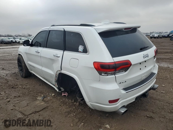 2014 Jeep Grand Cherokee Overland with VIN 1C4RJFCG7EC572298, listed as a Copart auction lot 83970004 with 104,861 mi miles and Salvage Title. Bid and sale history available at DreamBid. Image 2.