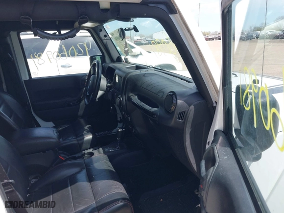 2012 Jeep Wrangler Unlimited Sahara with VIN 1C4HJWEG3CL254944, listed as a IAAI auction lot 42060981 with 172,358 mi miles. Bid and sale history available at carsss.com. Image 5.