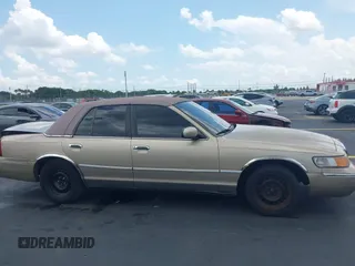 1999 Mercury Grand Marquis LS z VIN 2MEFM75W7XX665959, wystawiony jako IAAI lot #42187818 z przebiegiem 123 126 mil mil oraz . Historia ofert i sprzedaży dostępna na DreamBid. Obrazek 13.