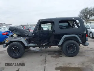 2004 Jeep Wrangler Sport with VIN 1J4FA49S64P794559, listed as a IAAI auction lot 41644201 with 107,445 mi miles. Bid and sale history available at carsss.com. Image 15.