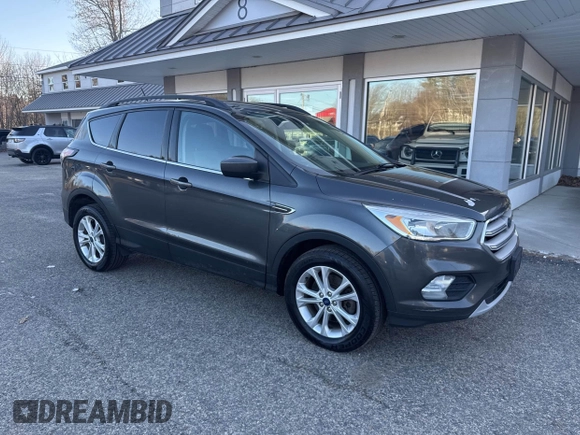 2018 Ford Escape SE with VIN 1FMCU9GD8JUA76991, listed as a IAAI auction lot 42013849 with 213,827 mi miles. Bid and sale history available at carsss.com. Image 1.