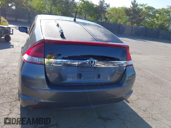 2012 Honda Insight EX z VIN JHMZE2H77CS001370, wystawiony jako IAAI lot #42312077 z przebiegiem 134 249 mil mil oraz . Historia ofert i sprzedaży dostępna na DreamBid. Obrazek 17.