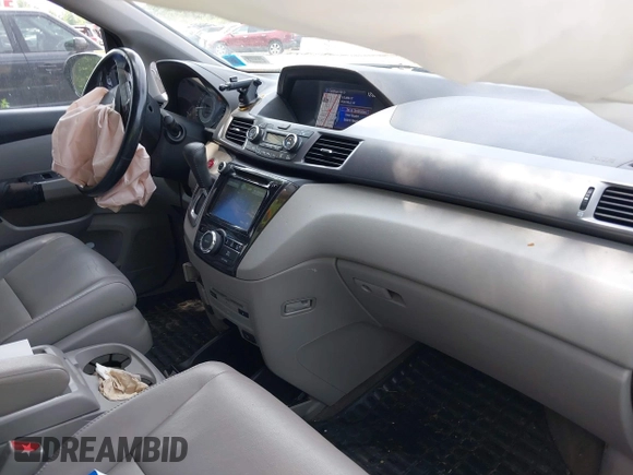 2014 Honda Odyssey Touring with VIN 5FNRL5H97EB054158, listed as a IAAI auction lot 42548360 with 91,161 mi miles and . Bid and sale history available at DreamBid. Image 5.