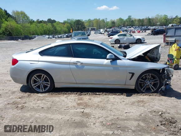 2014 BMW 4 Series 428i with VIN WBA3N7C50EK220438, listed as a IAAI auction lot 41990873 with 141,736 mi miles and . Bid and sale history available at carsss.com. Image 13.