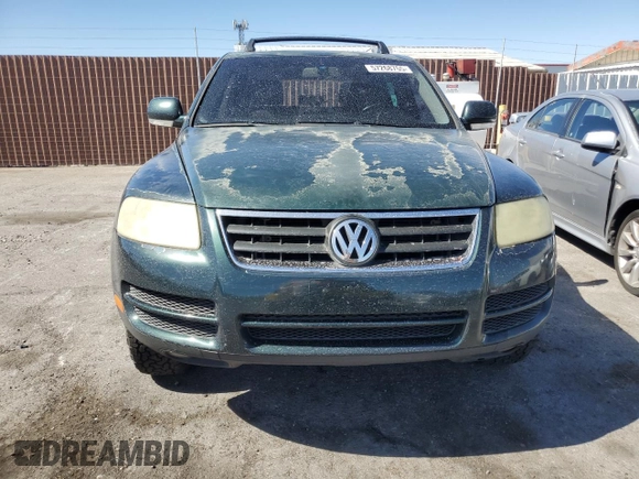 2005 Volkswagen Touareg z VIN WVGBG77L25D010568, wystawiony jako Copart lot #57268755 z przebiegiem 229 928 mil mil oraz Szkoda całkowita • Salvage title. Historia ofert i sprzedaży dostępna na DreamBid. Obrazek 5.