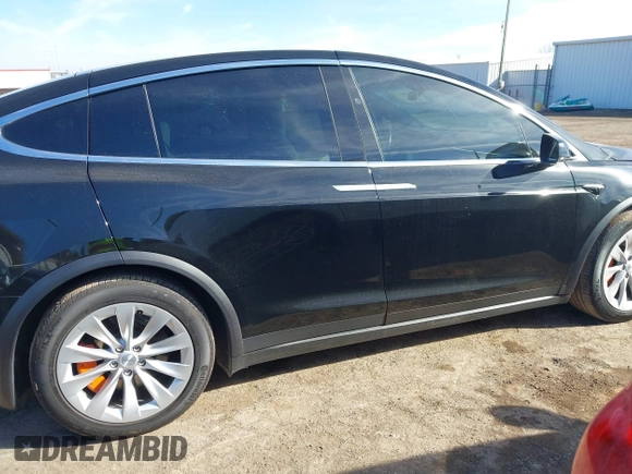 2018 Tesla Model X 75D with VIN 5YJXCDE44JF091690, listed as a IAAI auction lot 41585617 with 128,826 mi miles and . Bid and sale history available at DreamBid. Image 13.
