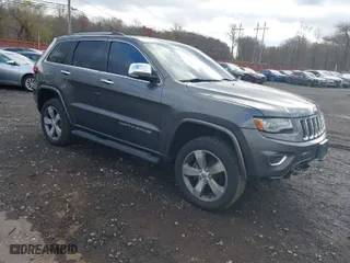2014 Jeep Grand Cherokee Overland with VIN 1C4RJFCG5EC329377, listed as a IAAI auction lot 40822324 with 106,222 mi miles. Bid and sale history available at carsss.com. Image 1.