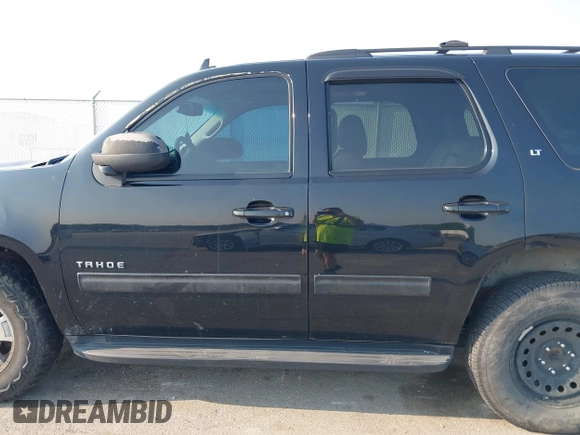 2014 Chevrolet Tahoe LT with VIN 1GNSCBE01ER235571, listed as a IAAI auction lot 42403118 with 238,069 mi miles and . Bid and sale history available at DreamBid. Image 14.