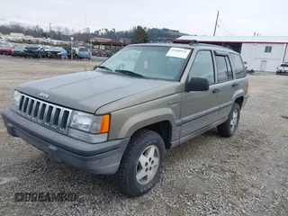 1995 Jeep Grand Cherokee Laredo with VIN 1J4GZ58S4SC555309, listed as a IAAI auction lot 41600141 with 130,493 mi miles. Bid and sale history available at carsss.com. Image 2.
