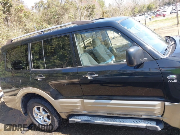 2002 Mitsubishi Montero XLS z VIN JA4MW31R52J070132, wystawiony jako IAAI lot #41782522 z przebiegiem 92 575 mil mil oraz . Historia ofert i sprzedaży dostępna na DreamBid. Obrazek 13.