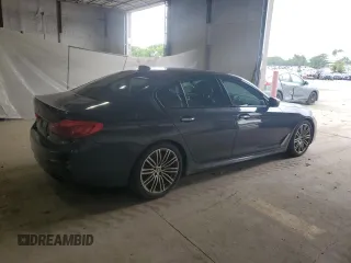 2018 BMW 5 Series M550i xDrive with VIN WBAJB9C58JB035267, listed as a Copart auction lot 64616605 with 125,365 mi miles and Clean title. Bid and sale history available at DreamBid. Image 3.