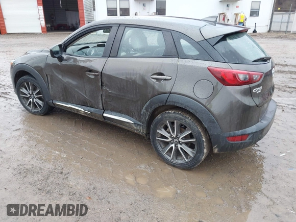 2016 Mazda CX-3 Grand Touring with VIN JM1DKBD77G0107328, listed as a IAAI auction lot 41682949 with 156,935 mi miles. Bid and sale history available at carsss.com. Image 3.