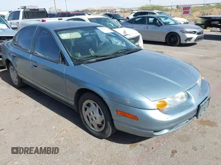 2002 Saturn SL z VIN 1G8ZK52772Z167733, wystawiony jako IAAI lot #42261908 z przebiegiem 137 215 mil mil oraz . Historia ofert i sprzedaży dostępna na DreamBid. Obrazek 1.