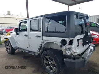 2017 Jeep Wrangler Unlimited Sahara with VIN 1C4HJWEG0HL595144, listed as a IAAI auction lot 41644511 with 143,512 mi miles. Bid and sale history available at carsss.com. Image 15.