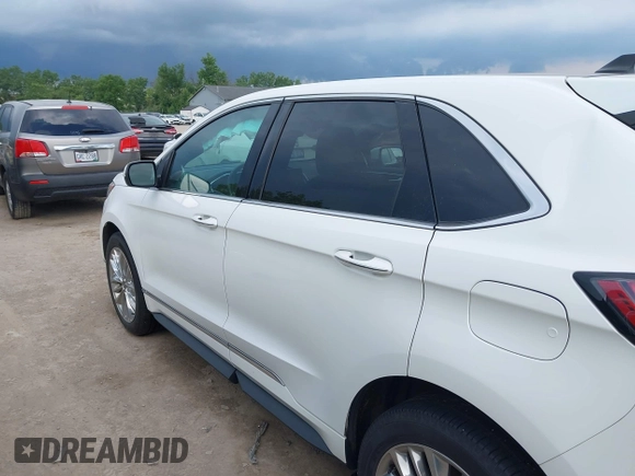 2021 Ford Edge Titanium with VIN 2FMPK4K96MBA18546, listed as a IAAI auction lot 42584326 with 65,214 mi miles and . Bid and sale history available at DreamBid. Image 14.