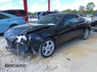 2006 Hyundai Tiburon GT z VIN KMHHN65F56U224768, wystawiony jako IAAI lot #40672721 z przebiegiem 158 535 mil mil oraz . Historia ofert i sprzedaży dostępna na DreamBid. Obrazek 2.