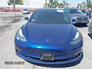 2020 Tesla Model 3 Standard Range Plus with VIN 5YJ3E1EA1LF590396, listed as a IAAI auction lot 41868089 with 51,278 mi miles. Bid and sale history available at carsss.com. Image 12.