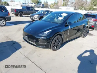 2024 Tesla Model Y Long Range with VIN 7SAYGDEEXRF983040, listed as a IAAI auction lot 41555332 with 79,506 mi miles and . Bid and sale history available at DreamBid. Image 19.
