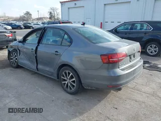 2016 Volkswagen Jetta Sedan 1.4T SE with VIN 3VWD67AJ7GM281671, listed as a IAAI auction lot 41385896 with 153,168 mi miles. Bid and sale history available at carsss.com. Image 3.