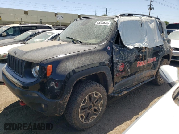 2015 Jeep Renegade Trailhawk z VIN ZACCJBCT9FPB21561, wystawiony jako Copart lot #63051673 z przebiegiem Nie podano mil oraz Szkoda całkowita • Salvage title. Historia ofert i sprzedaży dostępna na DreamBid. Obrazek 1.