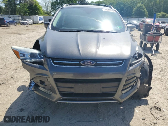 2015 Ford Escape Titanium with VIN 1FMCU9J92FUC74879, listed as a Copart auction lot 54683185 with 143,436 mi miles and Salvage title. Bid and sale history available at DreamBid. Image 5.