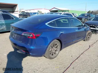 2018 Tesla Model 3 Long Range Battery with VIN 5YJ3E1EA2JF037835, listed as a IAAI auction lot 41667875 with 106,528 mi miles. Bid and sale history available at carsss.com. Image 4.