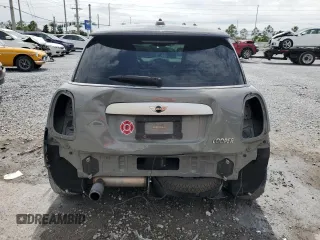 2014 MINI Hardtop with VIN WMWXM5C51ET934047, listed as a Copart auction lot 63039335 with 104,446 mi miles and Salvage title. Bid and sale history available at DreamBid. Image 6.