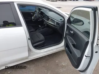 2019 Kia Rio S with VIN 3KPA24ABXKE215756, listed as a IAAI auction lot 41556461 with 122,300 mi miles. Bid and sale history available at carsss.com. Image 5.