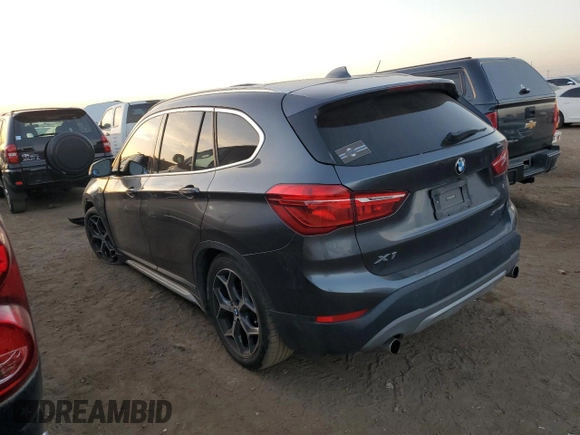 2018 BMW X1 xDrive28i with VIN WBXHT3C38J3H33310, listed as a Copart auction lot 73492324 with 88,620 mi miles and Salvage Title. Bid and sale history available at carsss.com. Image 2.