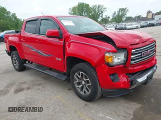 2015 GMC Canyon 4WD SLE z VIN 1GTG6BE33F1144298, wystawiony jako IAAI lot #42137000 z przebiegiem 122 403 mil mil oraz . Historia ofert i sprzedaży dostępna na DreamBid. Obrazek 1.