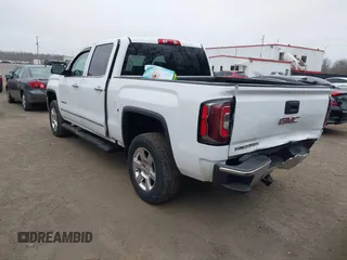 2018 GMC Sierra 1500 SLT z VIN 3GTU2NEC1JG402263, wystawiony jako IAAI lot #41786328 z przebiegiem 100 097 mil mil oraz . Historia ofert i sprzedaży dostępna na DreamBid. Obrazek 3.