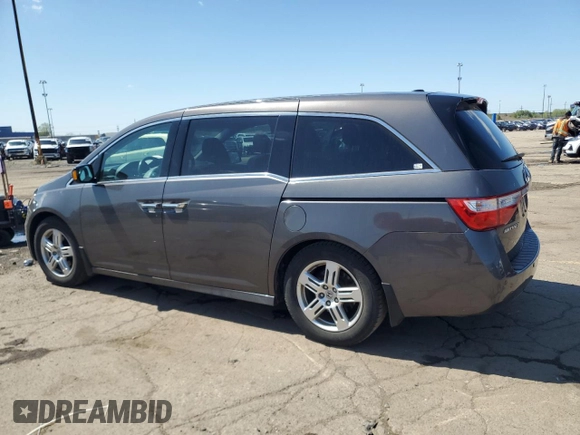 2012 Honda Odyssey Touring with VIN 5FNRL5H90CB093963, listed as a Copart auction lot 55434725 with 202,867 mi miles and Salvage Title. Bid and sale history available at DreamBid. Image 2.