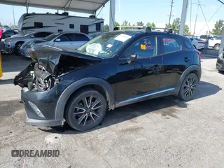 2016 Mazda CX-3 Grand Touring z VIN JM1DKBD73G0111148, wystawiony jako IAAI lot #42260375 z przebiegiem Nie podano mil oraz . Historia ofert i sprzedaży dostępna na DreamBid. Obrazek 2.