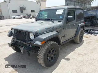 2022 Jeep Wrangler Sport S z VIN 1C4GJXAG8NW232480, wystawiony jako IAAI lot #42248150 z przebiegiem 23 918 mil mil oraz . Historia ofert i sprzedaży dostępna na DreamBid. Obrazek 2.