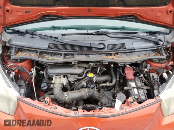 2012 Scion iQ with VIN JTNJJXB07CJ017816, listed as a Copart auction lot 59616355 with 141,384 mi miles and Salvage title. Bid and sale history available at DreamBid. Image 11.
