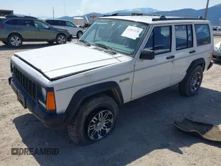1996 Jeep Cherokee SE with VIN 1J4FT28S7TL307603, listed as a IAAI auction lot 42087278 with 141,994 mi miles. Bid and sale history available at carsss.com. Image 2.