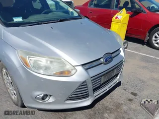 2012 Ford Focus SE with VIN 1FAHP3K28CL343856, listed as a IAAI auction lot 41990103 with 176,588 mi miles. Bid and sale history available at carsss.com. Image 6.