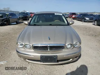 2004 Jaguar X-Type with VIN SAJEA51C64WD66013, listed as a Copart auction lot 50635615 with 47,365 mi miles and Salvage Title. Bid and sale history available at carsss.com. Image 5.