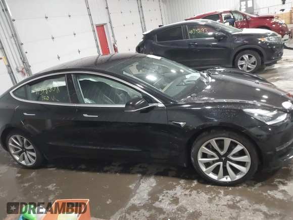 2018 Tesla Model 3 Long Range Battery with VIN 5YJ3E1EB7JF086778, listed as a IAAI auction lot 41348008 with 74,491 mi miles and . Bid and sale history available at DreamBid. Image 13.