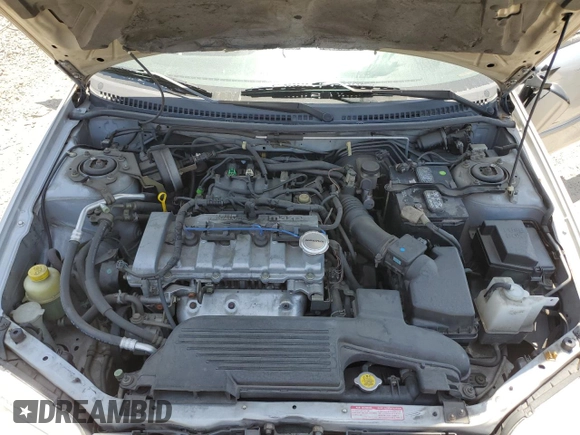 2002 Mazda Protege DX z VIN JM1BJ225920543960, wystawiony jako Copart lot #56336555 z przebiegiem 173 874 mil mil oraz Szkoda całkowita • Salvage title. Historia ofert i sprzedaży dostępna na DreamBid. Obrazek 11.