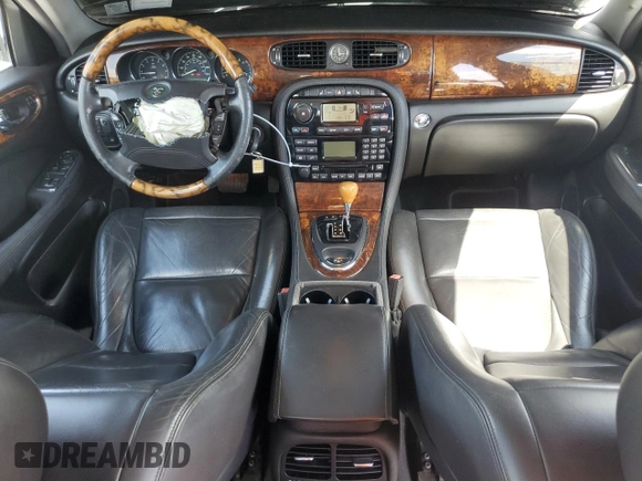 2004 Jaguar XJ with VIN SAJEA71C14SG10928, listed as a Copart auction lot 51202785 with 164,300 mi miles and Salvage Title. Bid and sale history available at carsss.com. Image 8.