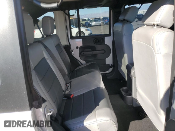 2007 Jeep Wrangler Unlimited Sahara with VIN 1J4GB59197L144781, listed as a Copart auction lot 48678315 with 137,538 mi miles and Salvage title. Bid and sale history available at DreamBid. Image 11.