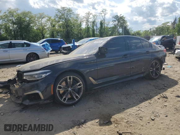 2020 BMW 5 Series M550i xDrive with VIN WBAJS7C03LCD00279, listed as a Copart auction lot 55698035 with 76,057 mi miles and Clean title. Bid and sale history available at DreamBid. Image 1.